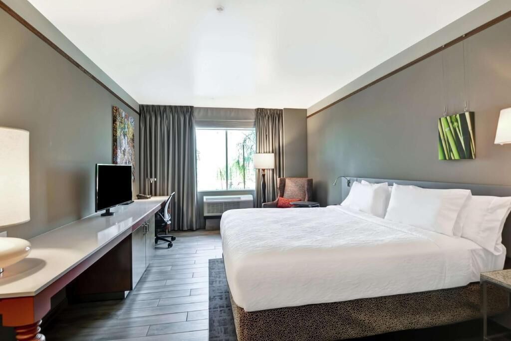 Premium bedding, desk, laptop workspace, iron/ironing board