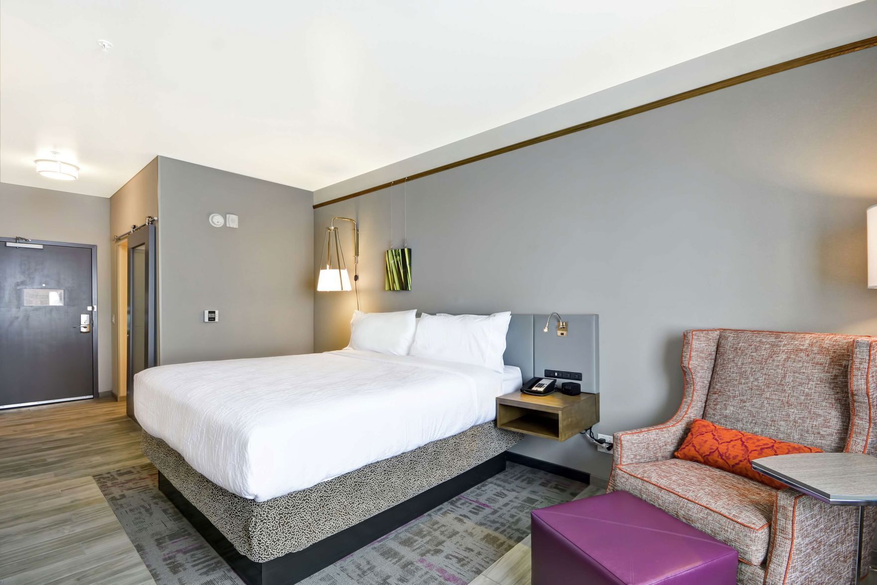Premium bedding, desk, laptop workspace, iron/ironing board