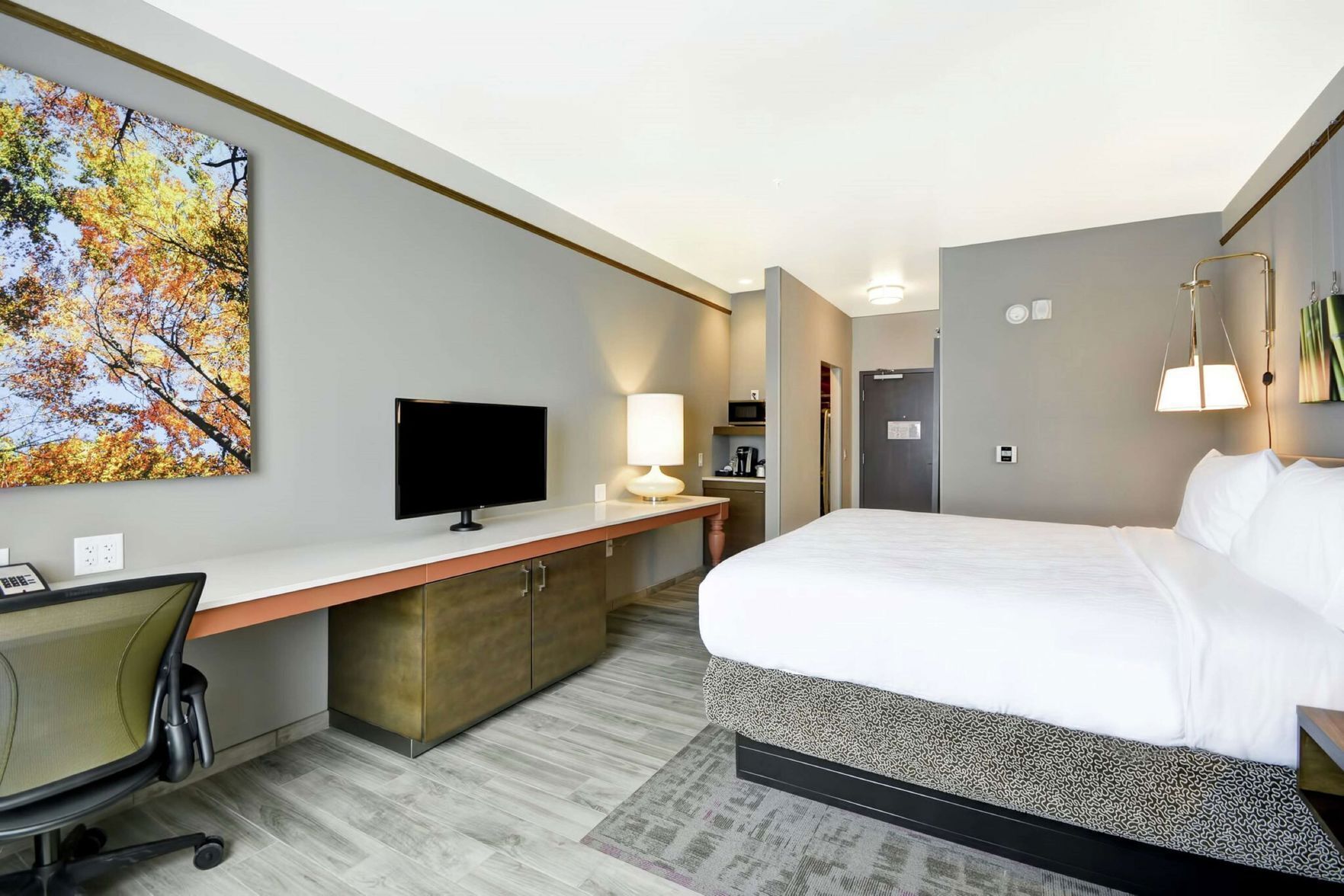 Premium bedding, desk, laptop workspace, iron/ironing board