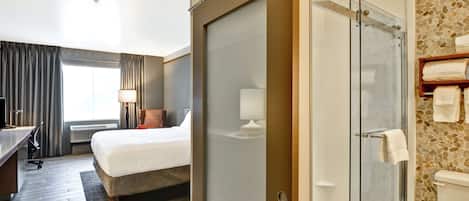 Premium bedding, desk, laptop workspace, iron/ironing board