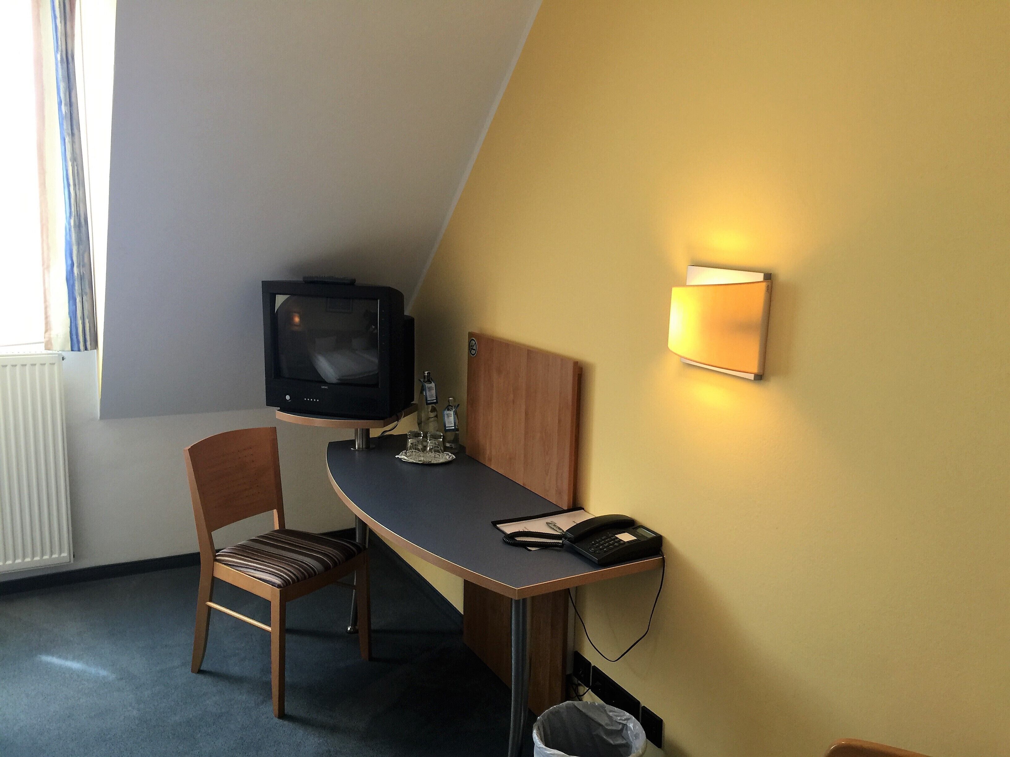 economy double room | living area | 32-inch tv with cable channels