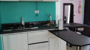 Executive Apartment, 1 Bedroom, Private Bathroom, Sea View | Private kitchen | Fridge, microwave, stovetop, coffee/tea maker
