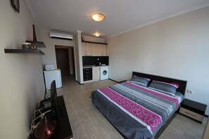 Estúdio conforto | Wi-Fi (sobretaxa), roupa de cama