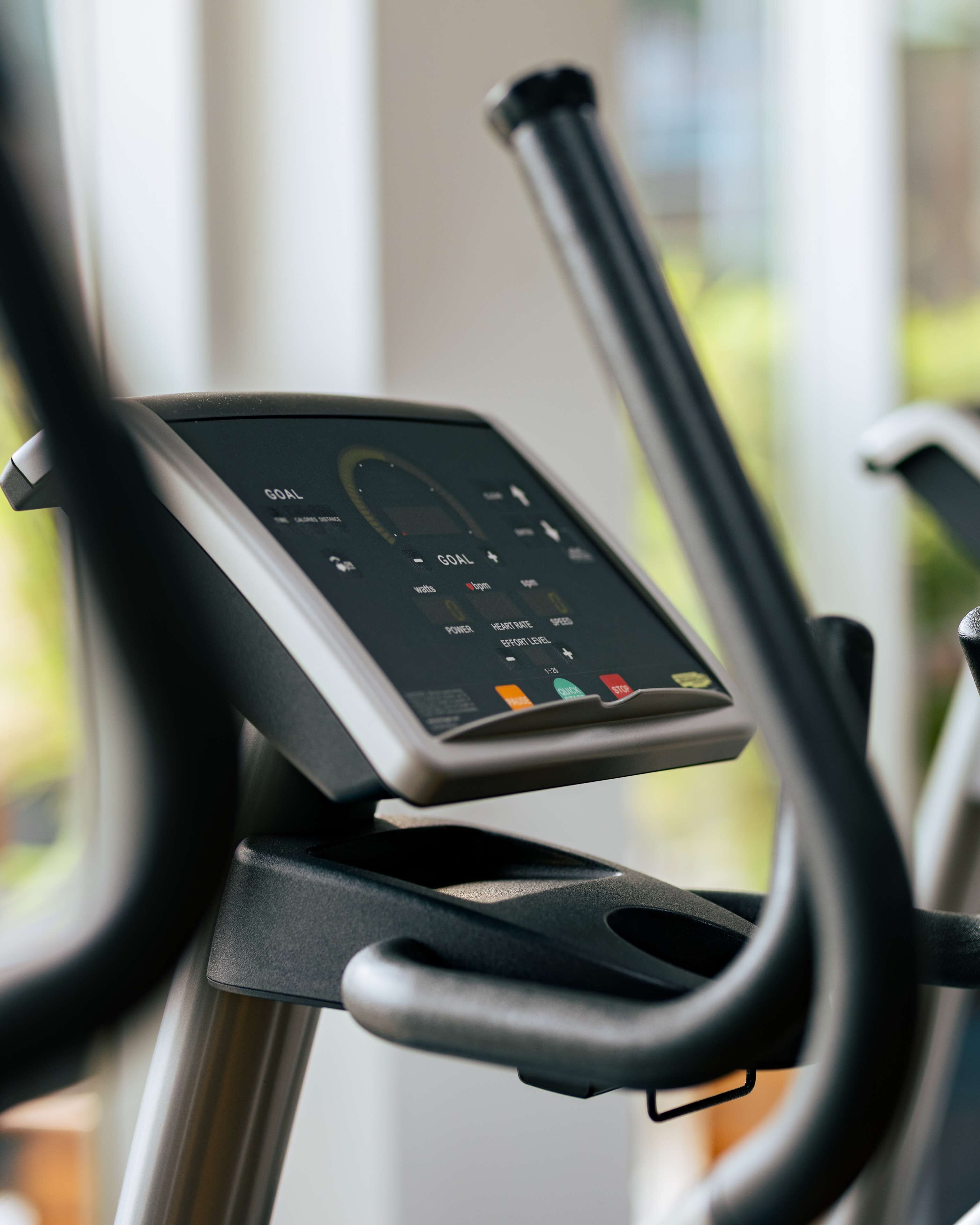 A stationary bike with a digital display and control panel.