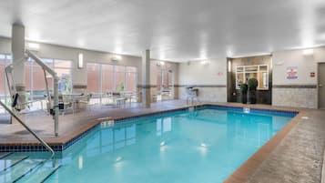Indoor pool, open 7:00 AM to midnight, pool loungers