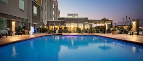 Outdoor pool, open 7:00 AM to 10 PM, pool umbrellas