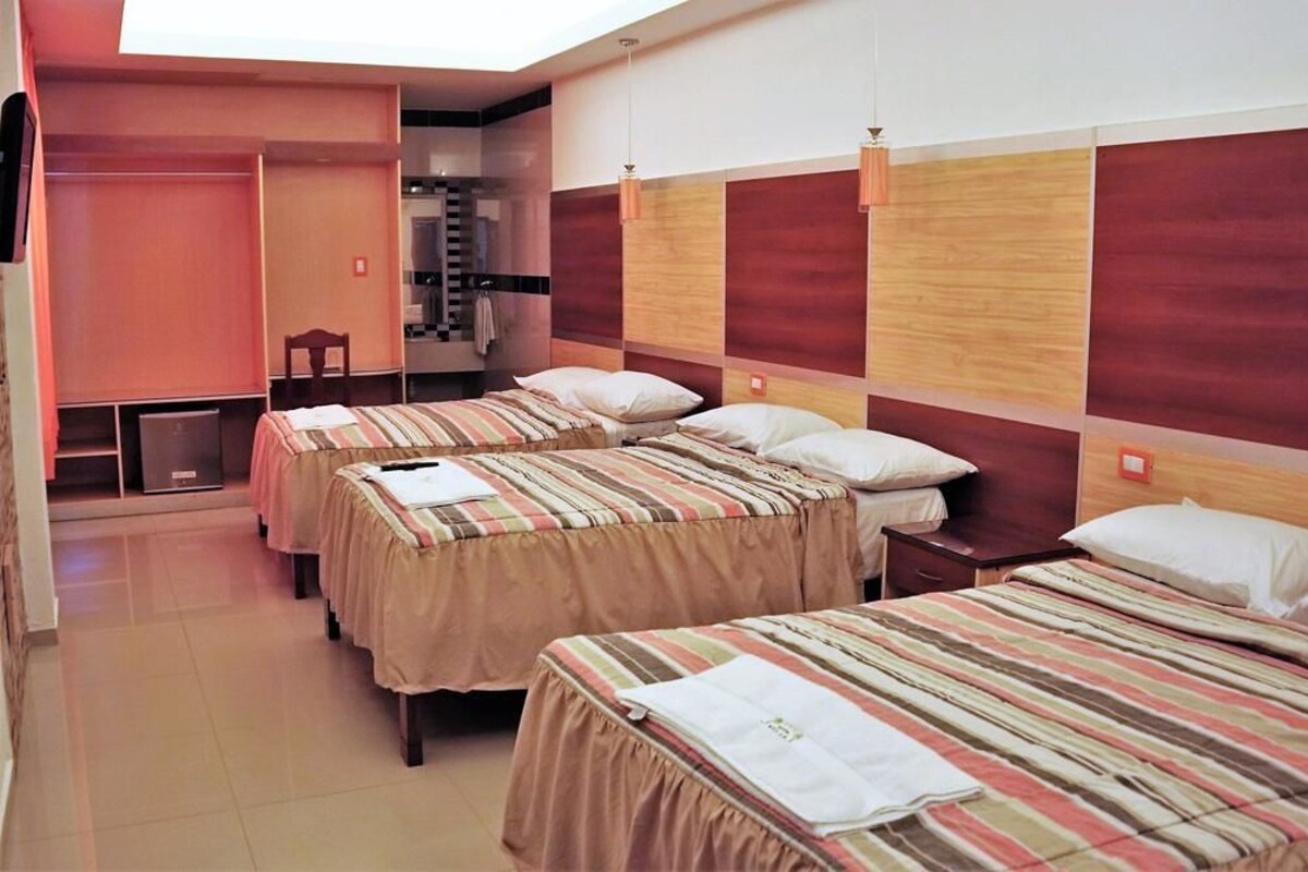 Deluxe Triple Room, Terrace | In-room safe, desk, free WiFi