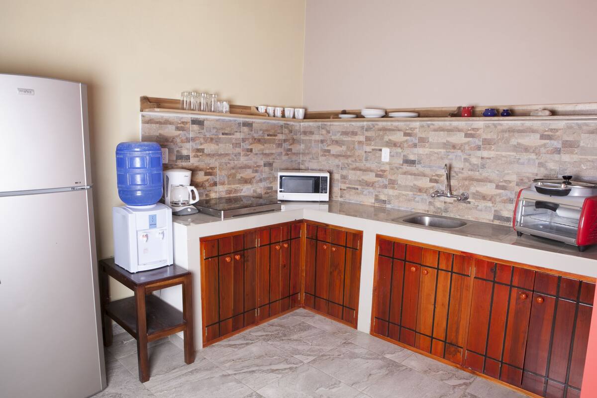 private kitchen | full-sized fridge, microwave, cleaning supplies, freezer