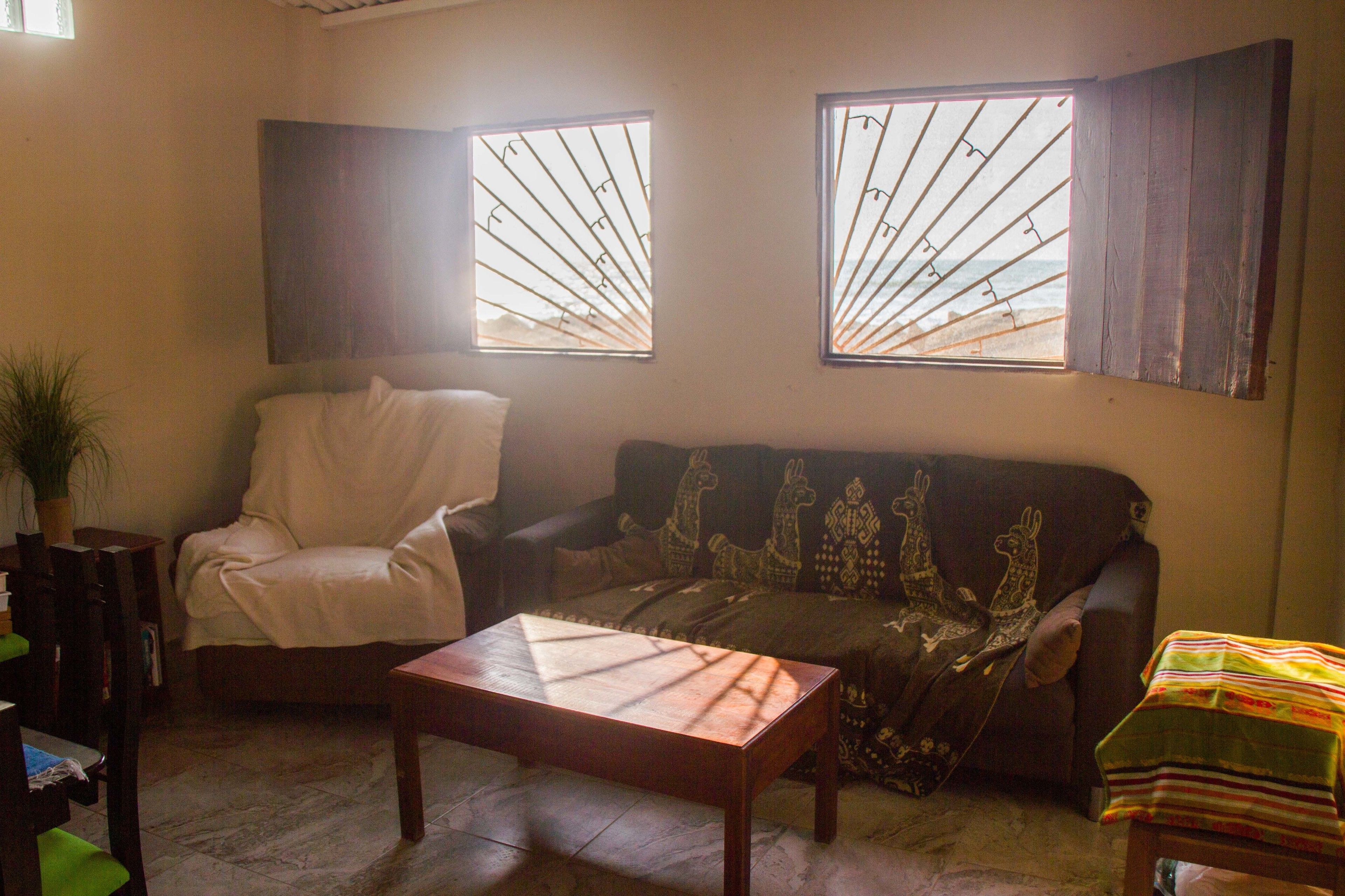 romantic cottage, 1 queen bed, kitchen, ocean view | living area | 32-inch flat-screen tv with cable channels, tv, netflix