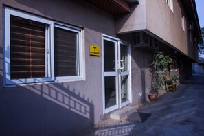 A building with a sign indicating a bar and restaurant. - EED Pension Boutique Hotel (Lagos)