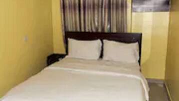 Desk, laptop workspace, bed sheets