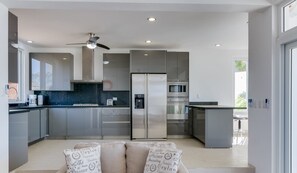Full-size fridge, microwave, stovetop, coffee/tea maker