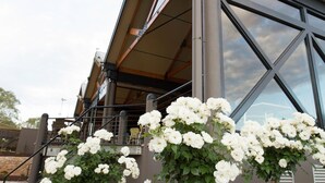 A modern building with large windows and a balcony. - Pretoria Hotel (Mannum)