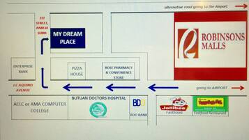 A map of a mall with various stores and amenities, including a pizza house, pharmacy, and fast food restaurants.