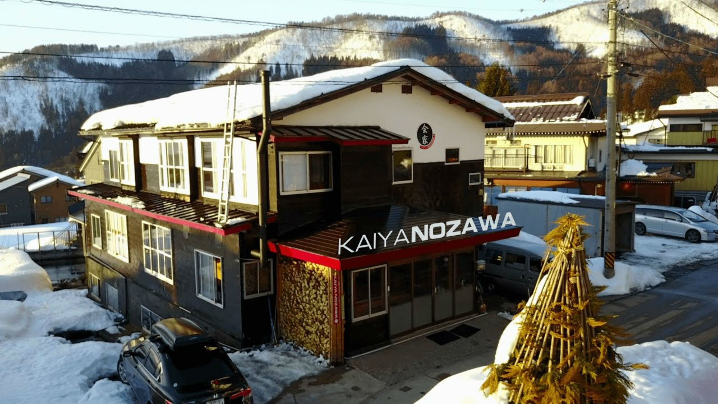 A two-story building with a sign reading "KAIYANOZAWA".