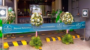 A spa entrance with a banner reading "Beyond Relaxation" and "RAFINA BAY SPA". - Hotel Fina (Tabaco City)