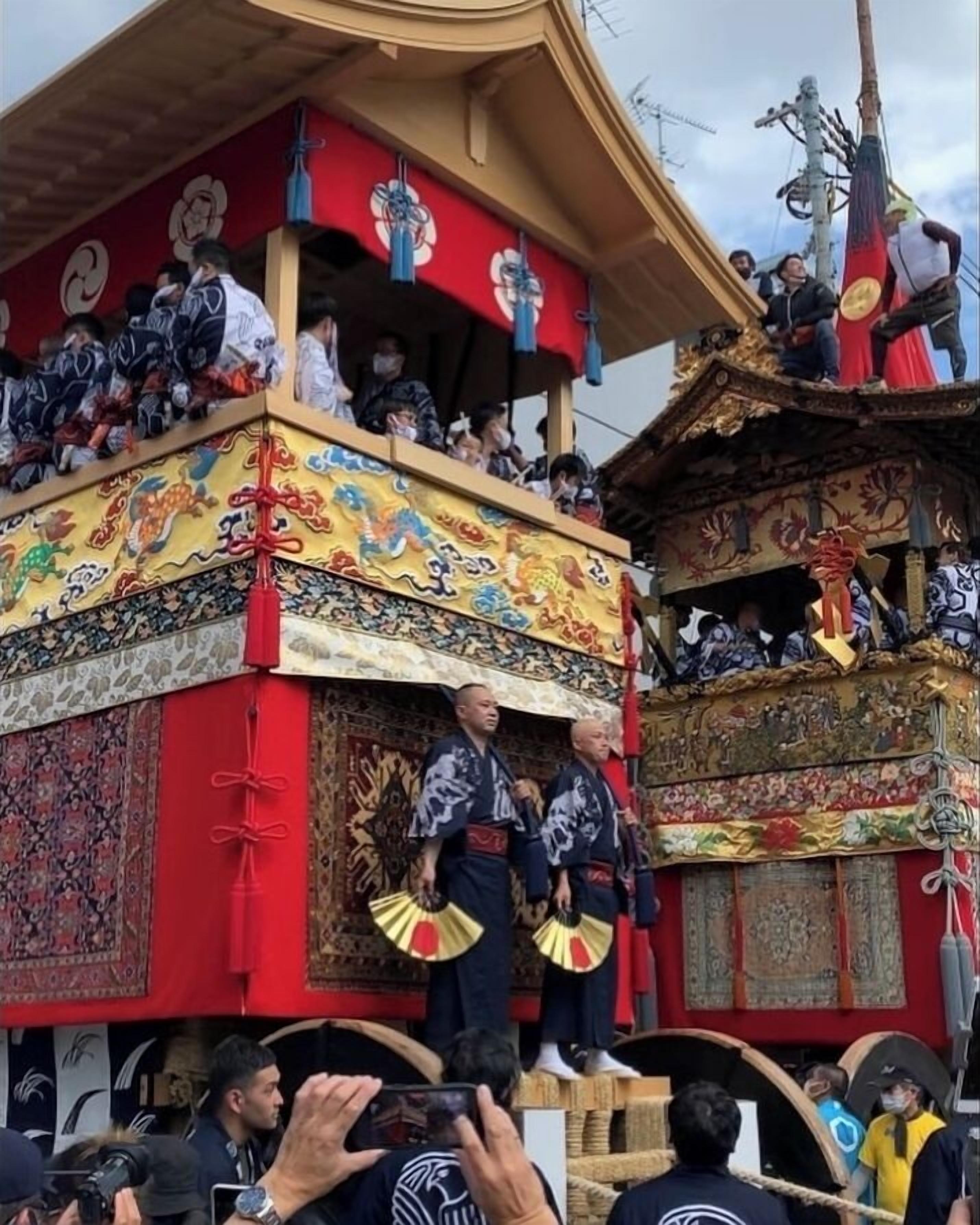 A traditional building with ornate decorations and a tiered structure.