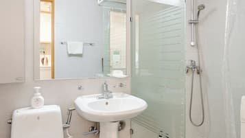 Shower, free toiletries, hair dryer, slippers