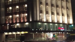 A multi-story hotel with illuminated signage, large windows, and a prominent entrance. - Asialink Easy by Prasanthi (Batam)