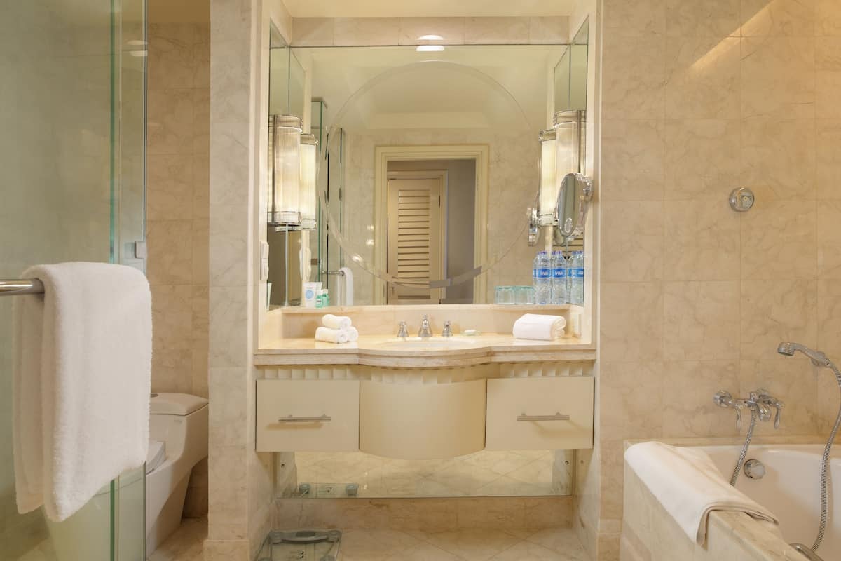 separate bathtub and shower, deep-soaking bathtub, rainfall showerhead