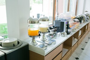 A buffet setup with self-serve beverage dispensers and a variety of food options. - Bridal Tea House Hotel Yantai Zhifu (Yantai)