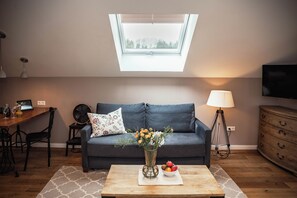 Apartment, Balcony | Living area | Flat-screen TV - Allgäuer Genusshotel und historischer Brauereigasthof Hirsch (Leutkirch im Allgau)