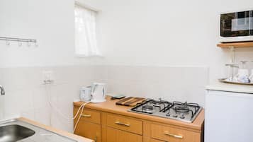 Family Room, Kitchenette | Desk, iron/ironing board, free WiFi