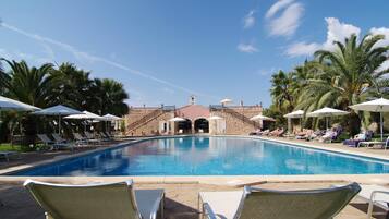 Indoor pool, outdoor pool, pool umbrellas, sun loungers