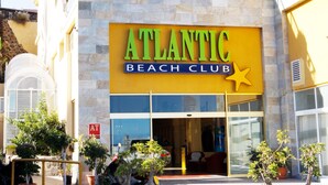 A building with a sign reading "ATLANTIC BEACH CLUB".