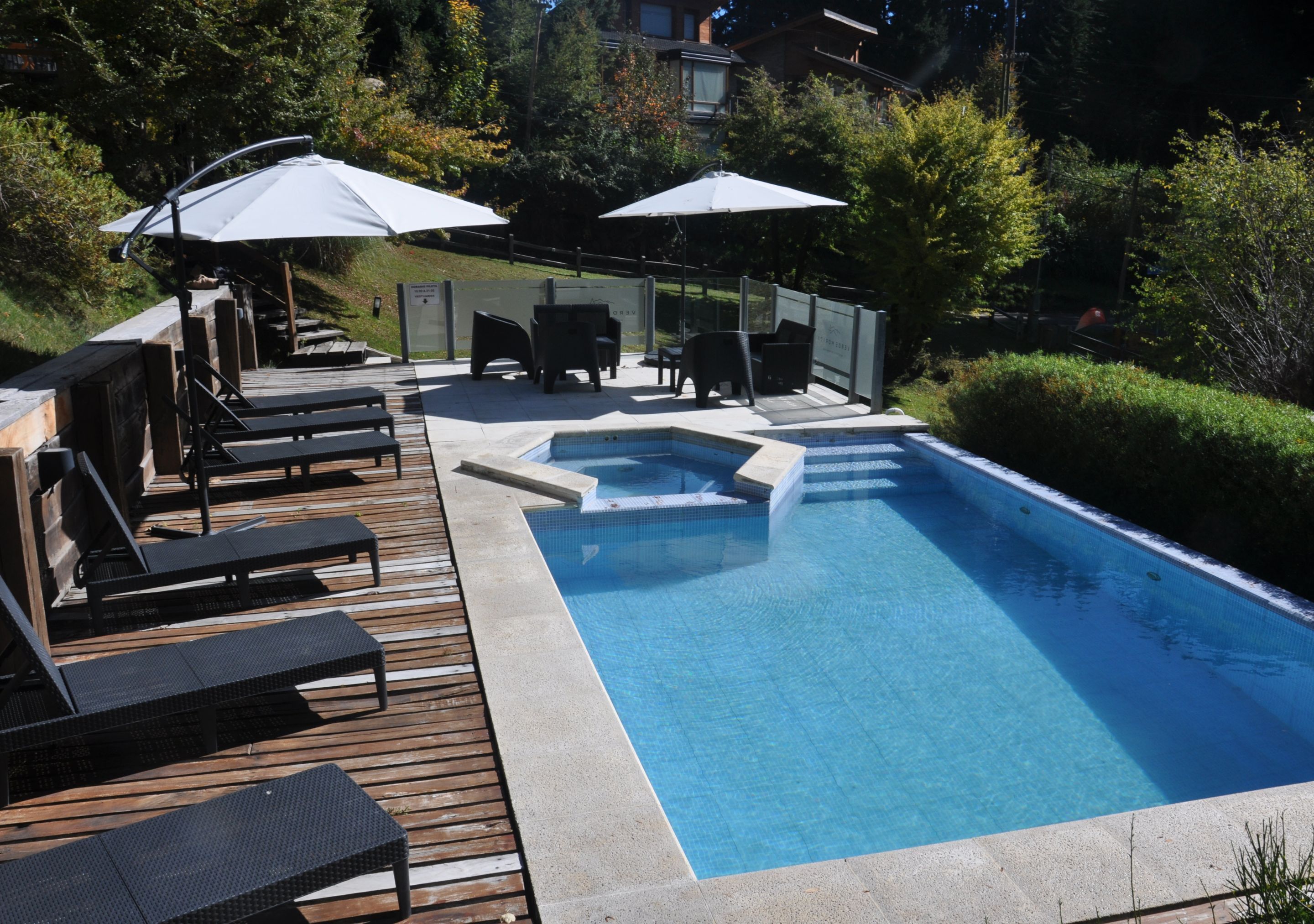 Seasonal outdoor pool, open 10:00 AM to 9:00 PM, pool umbrellas