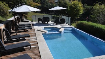 Seasonal outdoor pool, open 10:00 AM to 9:00 PM, pool umbrellas