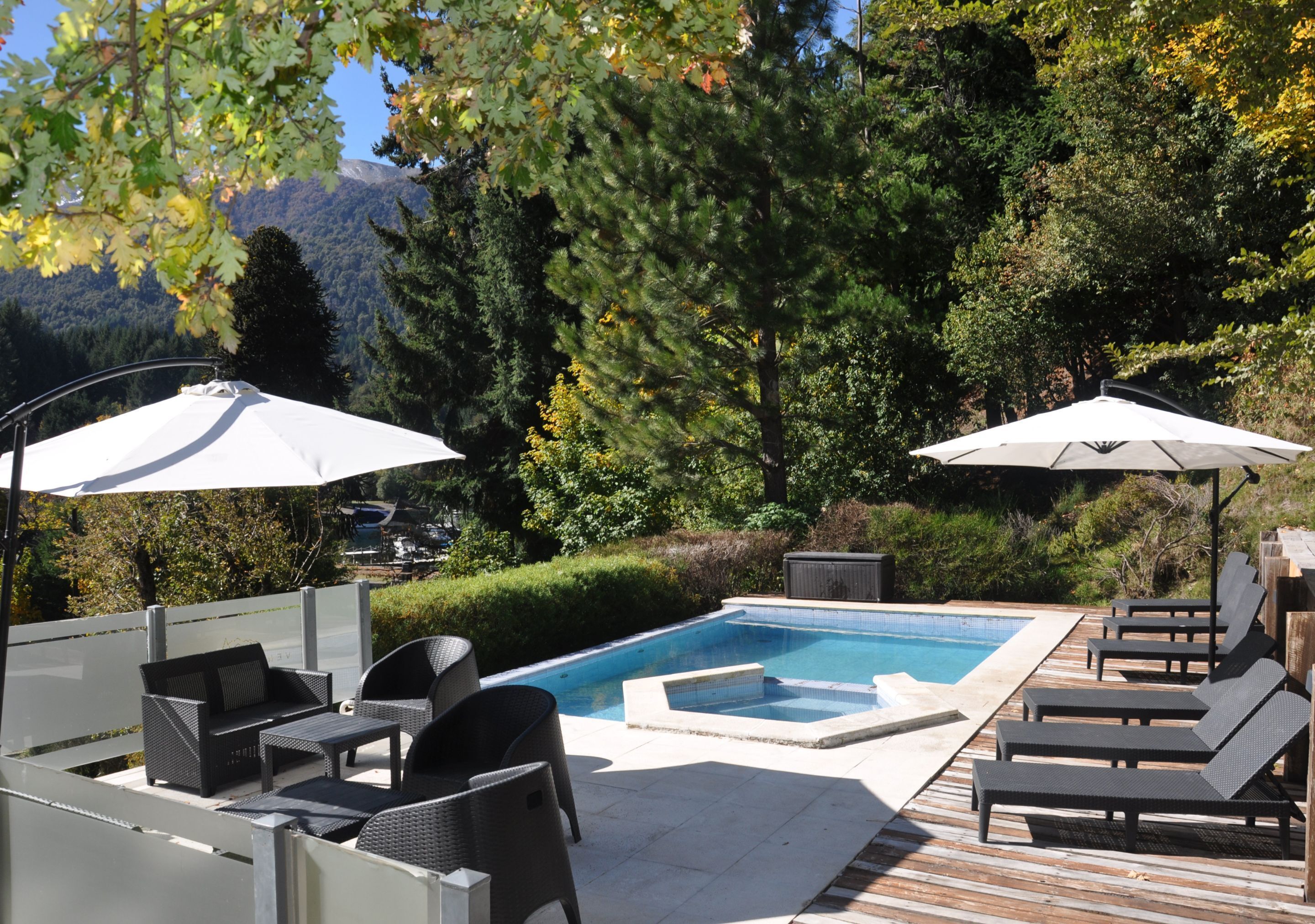Seasonal outdoor pool, open 10:00 AM to 9:00 PM, pool umbrellas