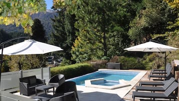 Seasonal outdoor pool, open 10:00 AM to 9:00 PM, pool umbrellas