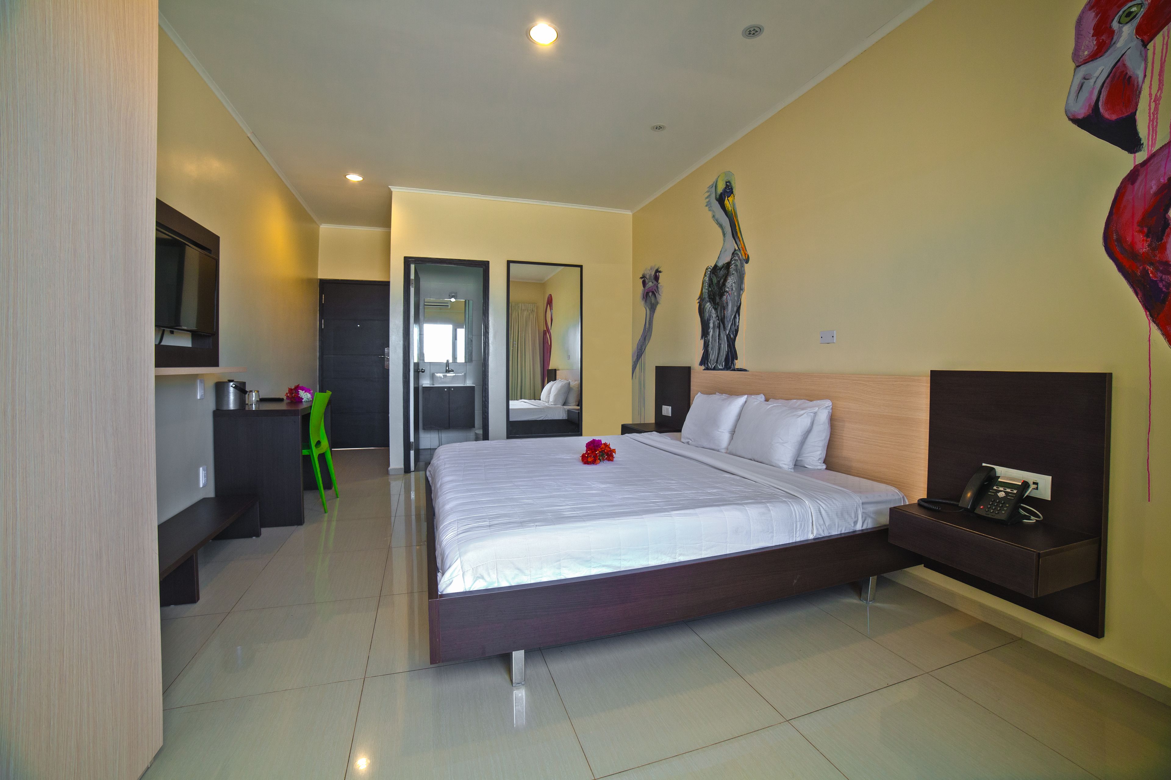 deluxe room, 1 king bed, balcony | 1 bedroom, desk, laptop workspace, iron/ironing board