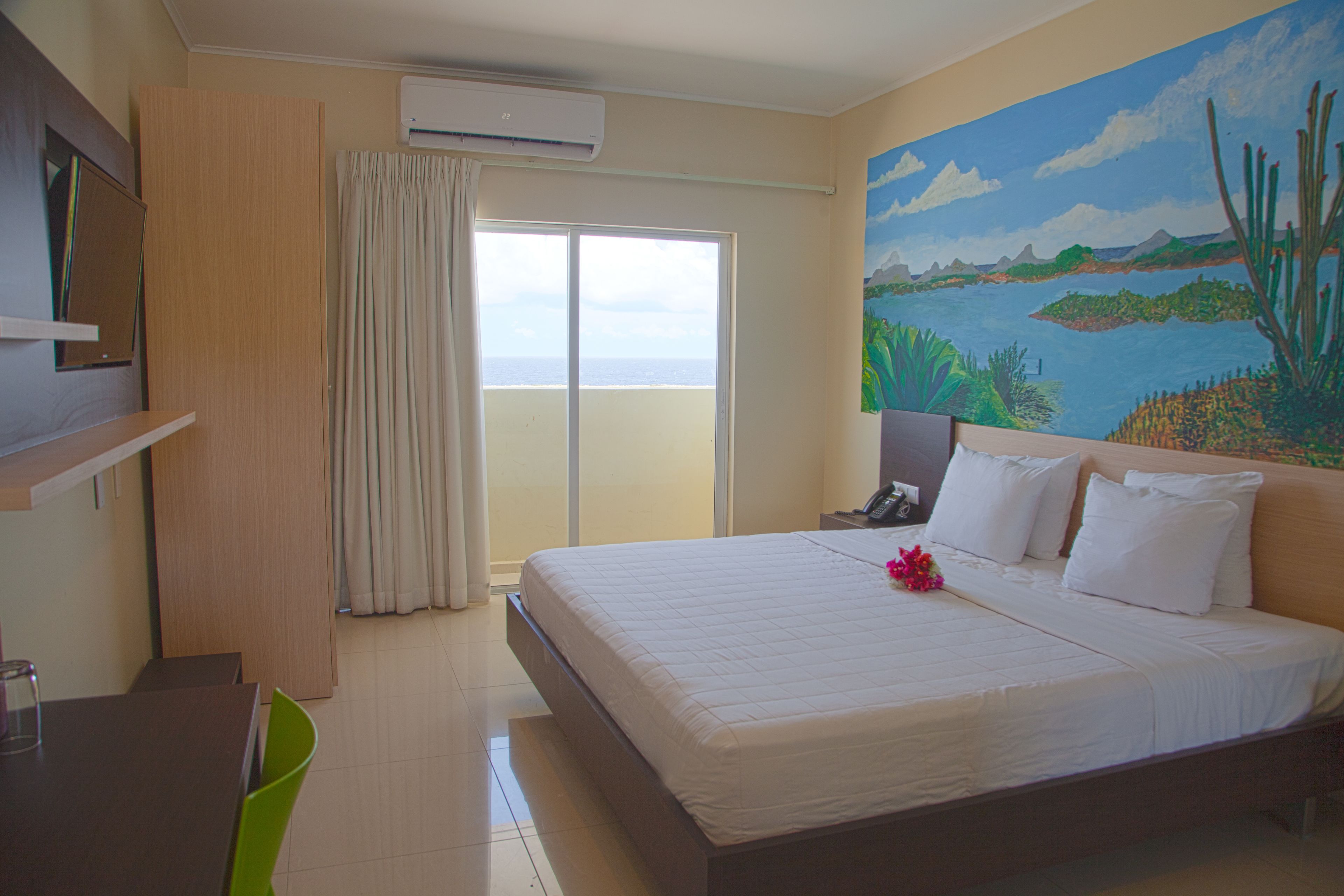 deluxe room, 1 king bed, balcony | 1 bedroom, desk, laptop workspace, iron/ironing board