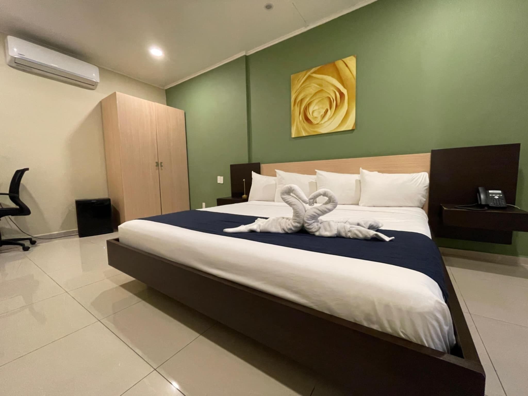 room, 1 king bed, no windows | 1 bedroom, desk, laptop workspace, iron/ironing board