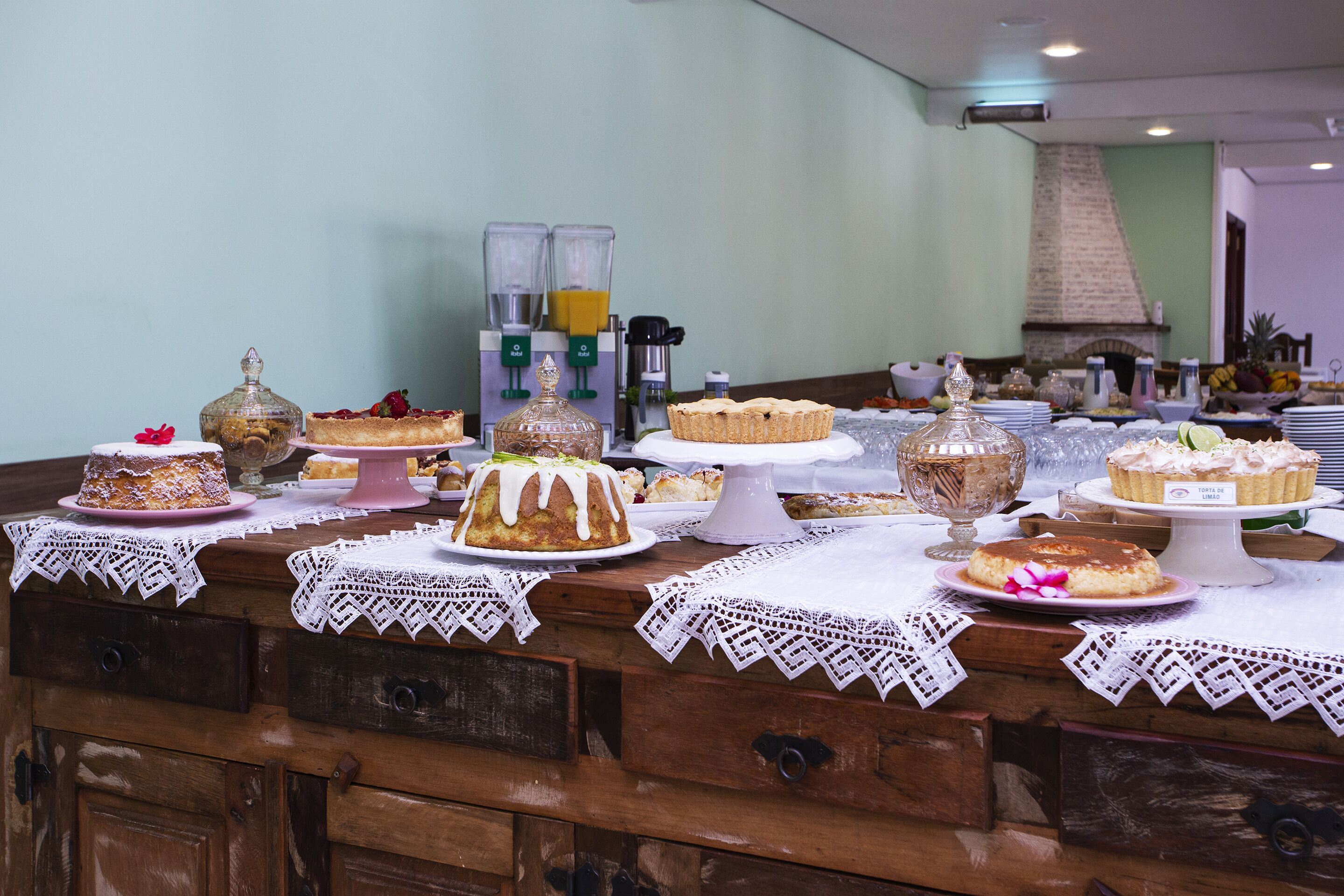A buffet table with various desserts and a coffee station.