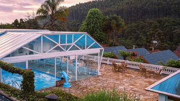 Indoor pool, open 9:00 AM to 6:00 PM, pool umbrellas, pool loungers
