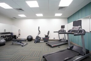 A fitness room with treadmills, an elliptical, dumbbells, and exercise balls. - Holiday Inn Express & Suites Sterling by IHG (Sterling)