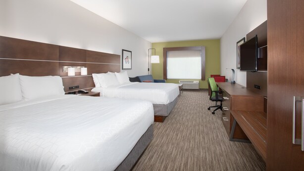 A hotel room with two beds, a desk, a chair, a television, and a window. - Holiday Inn Express & Suites Sterling by IHG (Sterling)