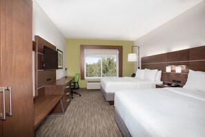 A hotel room with two beds, a desk, a chair, a TV, and a window with a view of trees. - Holiday Inn Express & Suites Sterling by IHG (Sterling)