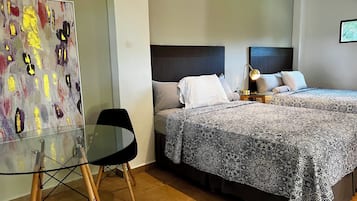 Deluxe Double Room, 1 Bedroom, Mountain View | Individually decorated, desk, laptop workspace, iron/ironing board