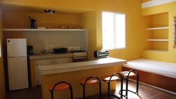 Villa, Beach View, Ground Floor | Private kitchen | Full-size fridge, oven, stovetop, coffee/tea maker