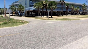 A multi-story hotel with a flat roof and balconies. - The Cove 217a 1 Bedroom Condo by RedAwning (Gulf Shores)