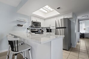 Condo, 2 Bedrooms | Private kitchen | Fridge, microwave, oven, coffee/tea maker - Sandy Shores West 101 2 Bedroom Condo by RedAwning (Gulf Shores)