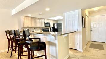Condo, 2 Bedrooms, Balcony, Beachfront | Private kitchen | Full-size fridge, microwave, oven, stovetop