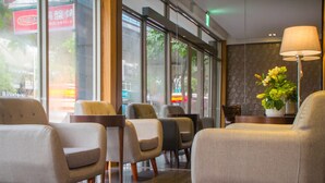 A modern interior with seating and a lamp. - The Koos Hotel Dahu (Taipei)