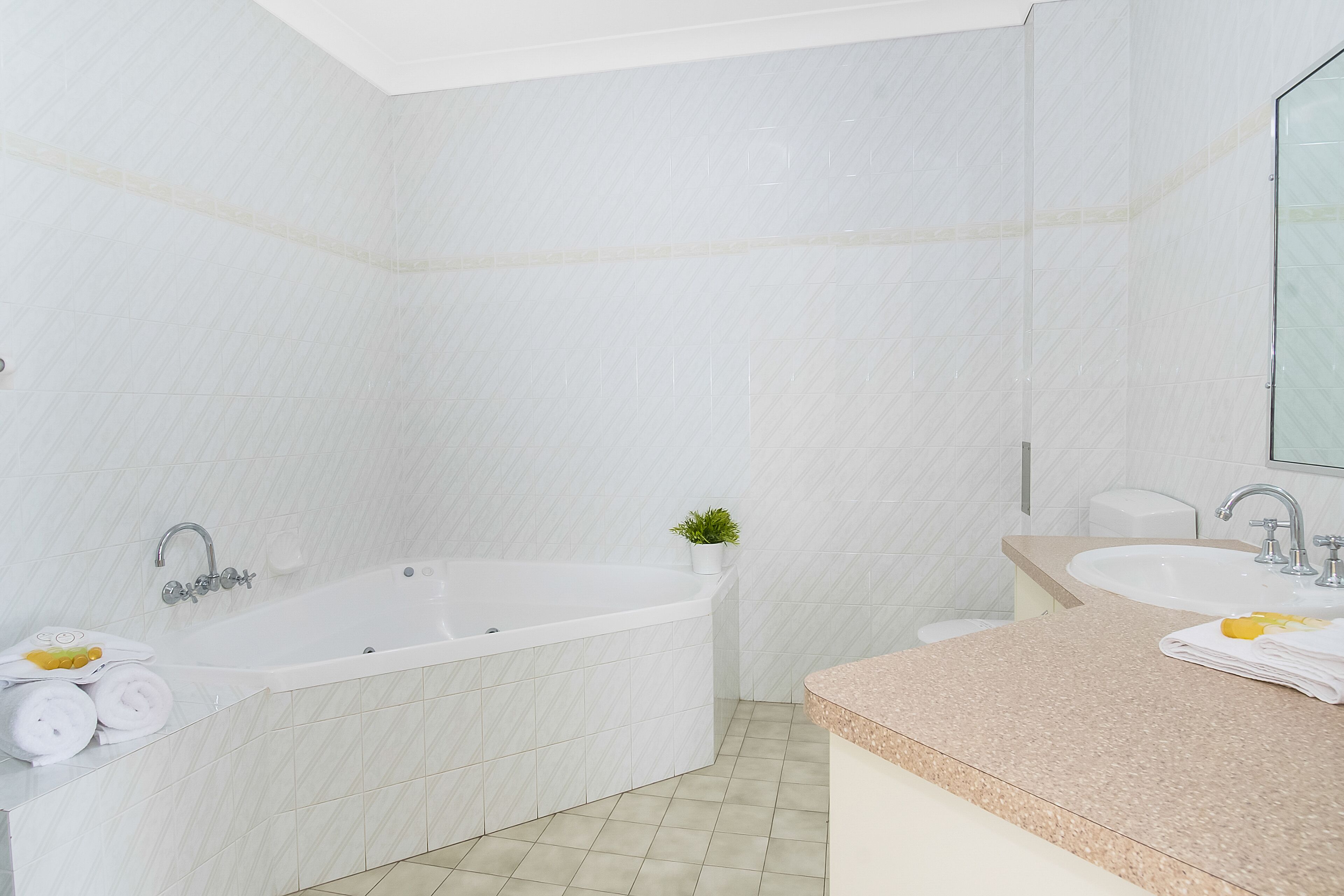 executive spa room | bathroom | shower, free toiletries, hair dryer, towels