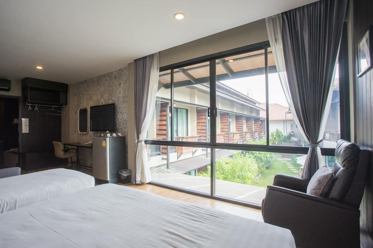 family triple room, multiple beds, non smoking, garden view | 1 bedroom, minibar, desk, blackout curtains