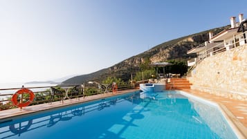 Outdoor pool, pool umbrellas, sun loungers